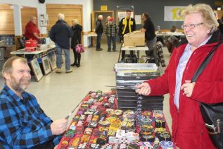 Pat Willman and Sheila Calthorpe face off in a wizard’s duel with the Harry Potter wands Willman was selling at the Verona Lions Vendors Market Saturday in Verona. Photo/Craig Bakay